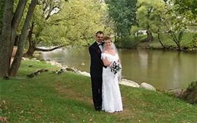 a couple getting married beside the river